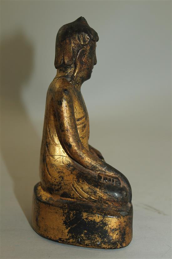 A Burmese gilt, composite and wood seated figure of Buddha, 19th century or later, 15.3cm